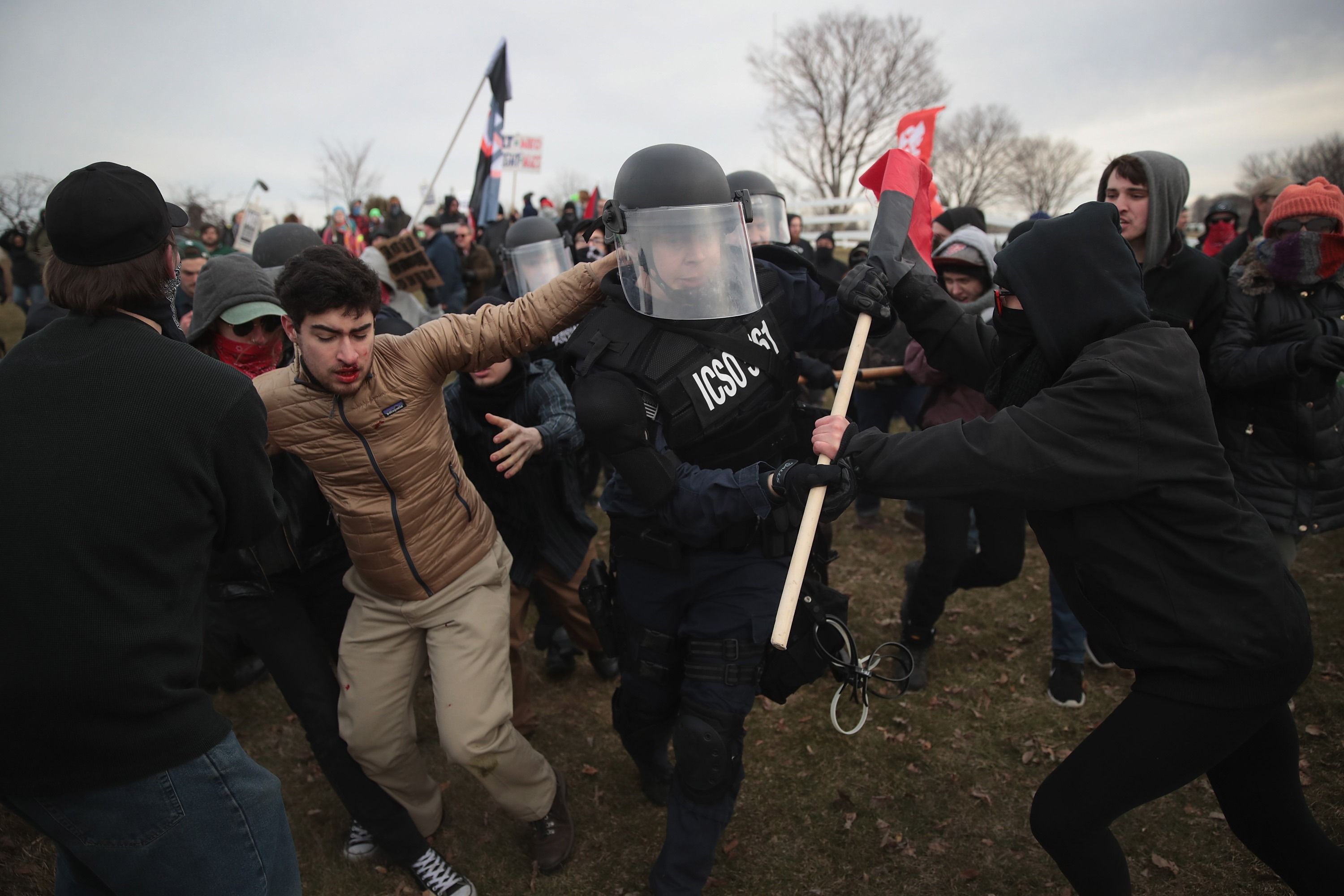 Police confront neo-Nazi supporters of Richard Spencer ahead of his speech at Michigan State University.