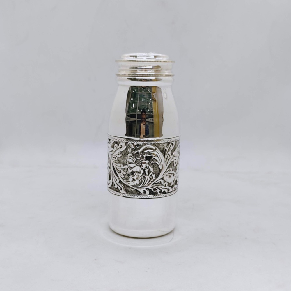 Hallmarked silver bottle in fine antique centre floral design carving