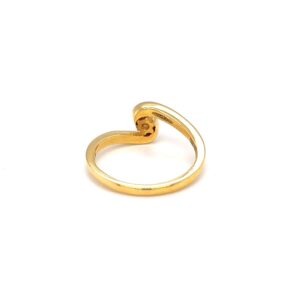 Single diamond engagement ring with cross band in yellow gold