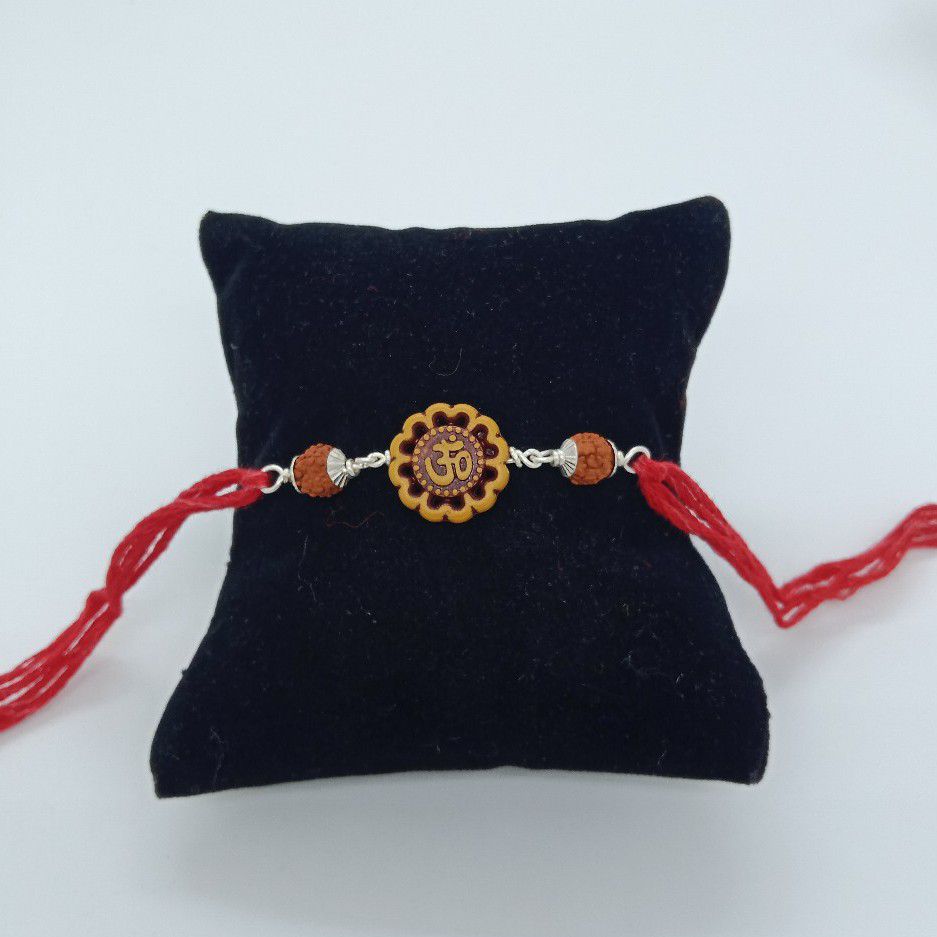 800 silver om design rakhi