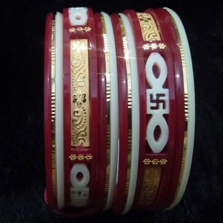 Gold swastik design plastic bangle