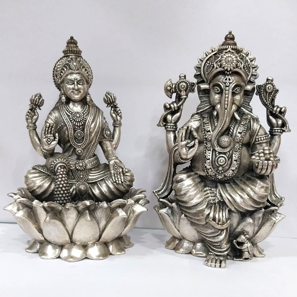Blissful Pure silver lakshmi ganesh idols On Lotus in high finishing