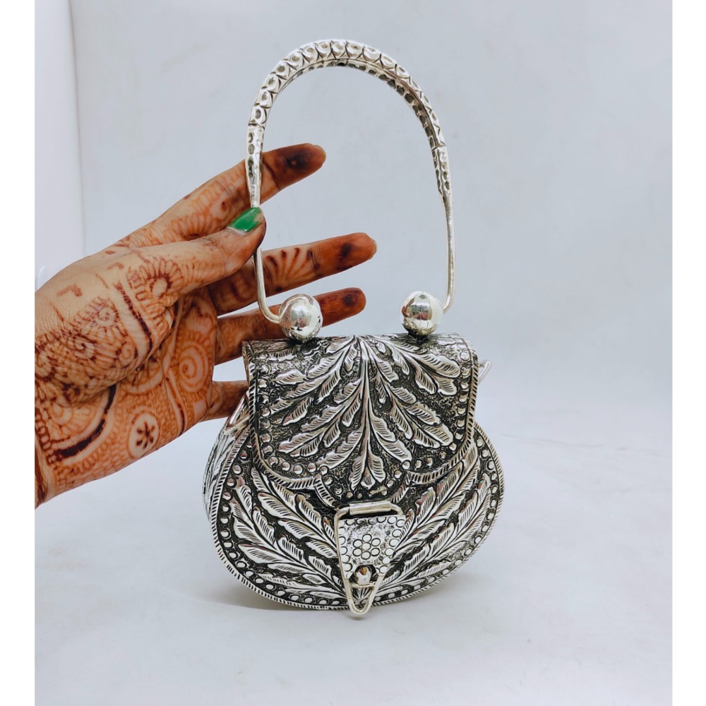 Hallmarked silver shoulder bag with antique fine work
