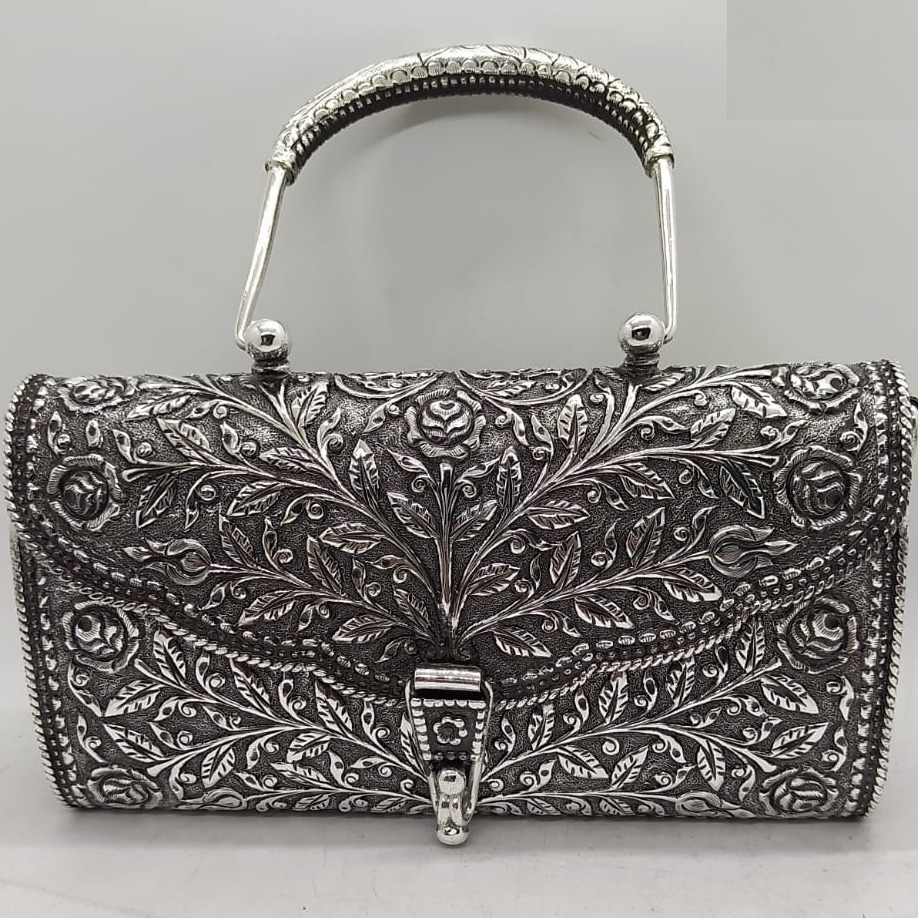 Maanniya hallmarked silver shoulder bag in easy to carry handle
