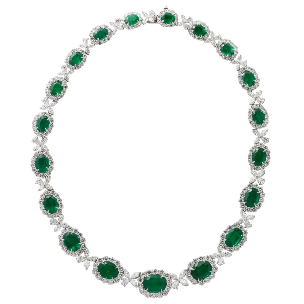 52.93 carats of VIVID GREEN fine emeralds.  41.37 carats