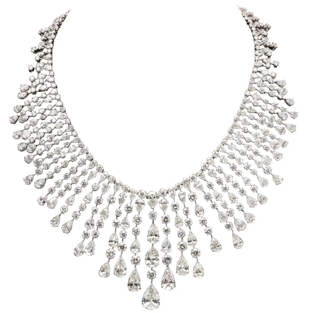 features over 128 carats of white pear shape and round diamonds.