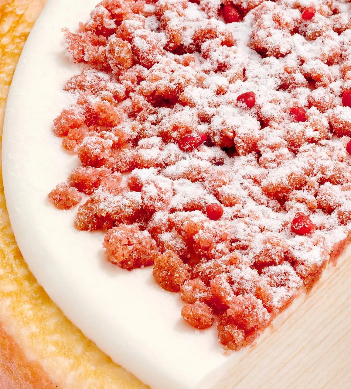 A close-up of Pink Pearl Mille Crêpes with a creamy white layer