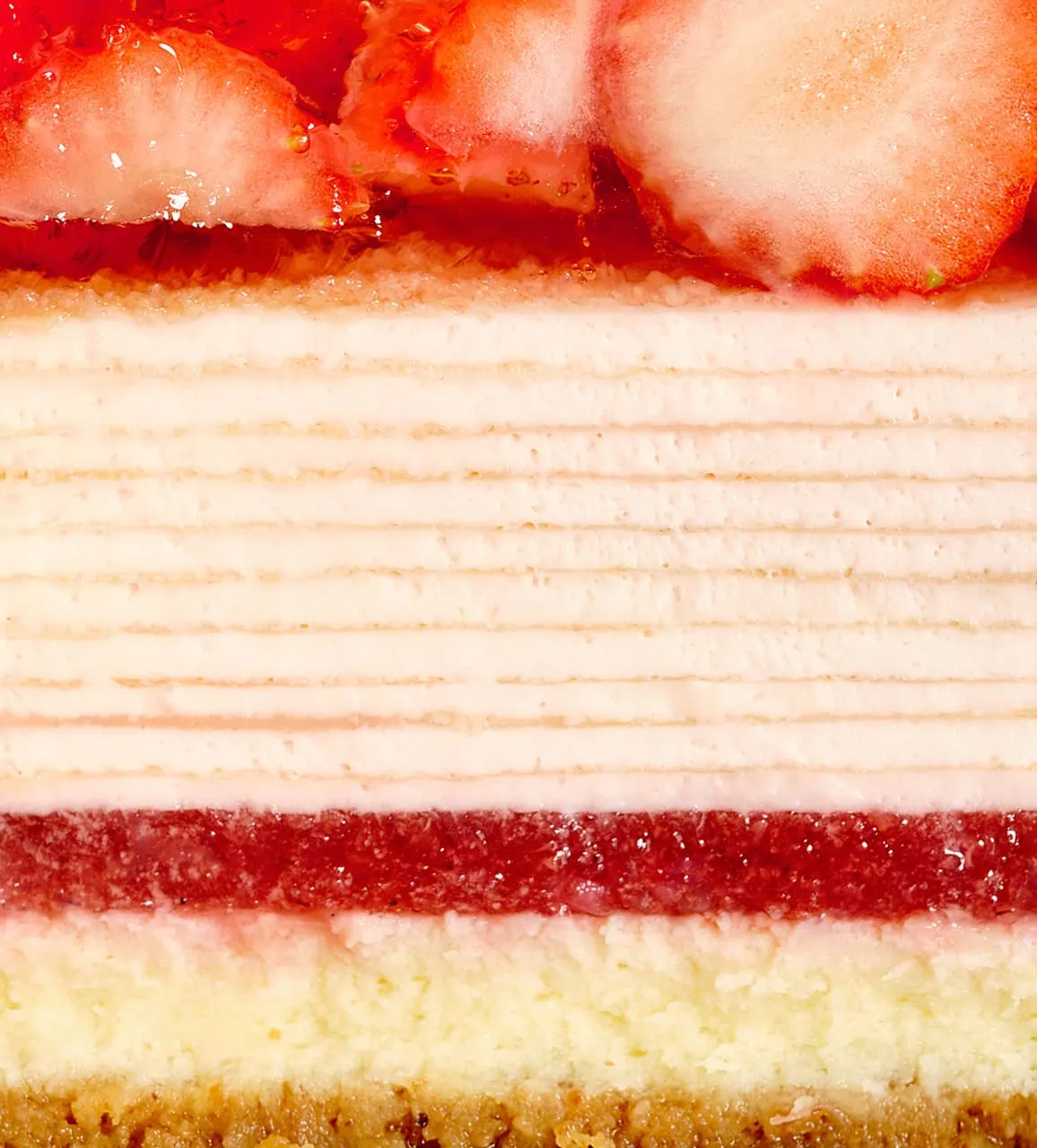 Close up of Oishii Berry Trois Mille Crêpes cake with three distinct layers
