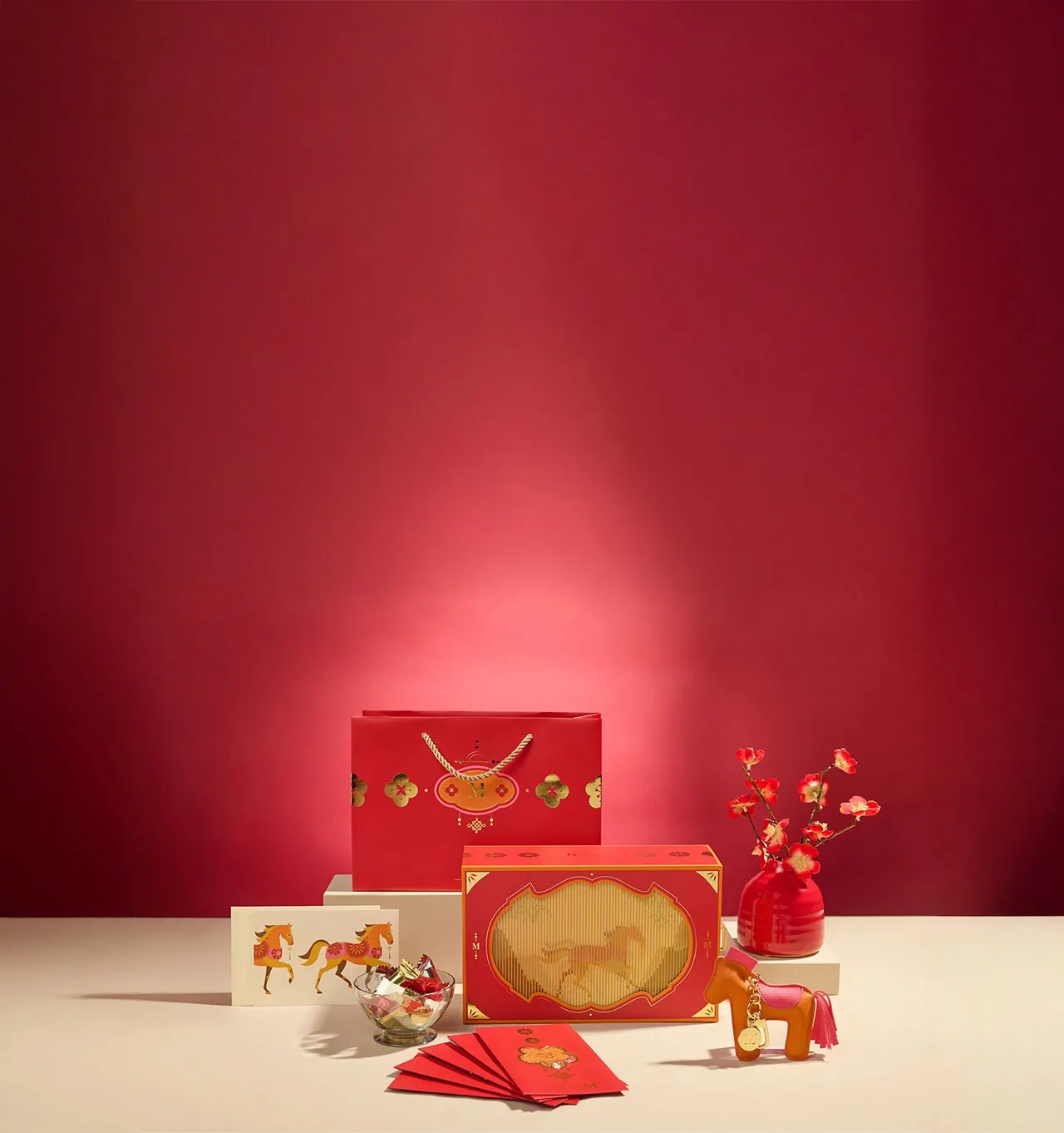 Year of the Horse Gift Set featuring the decorative bag, vegan leather horse keepsake, red envelopes, greeting card, and mini crêpe biscuits