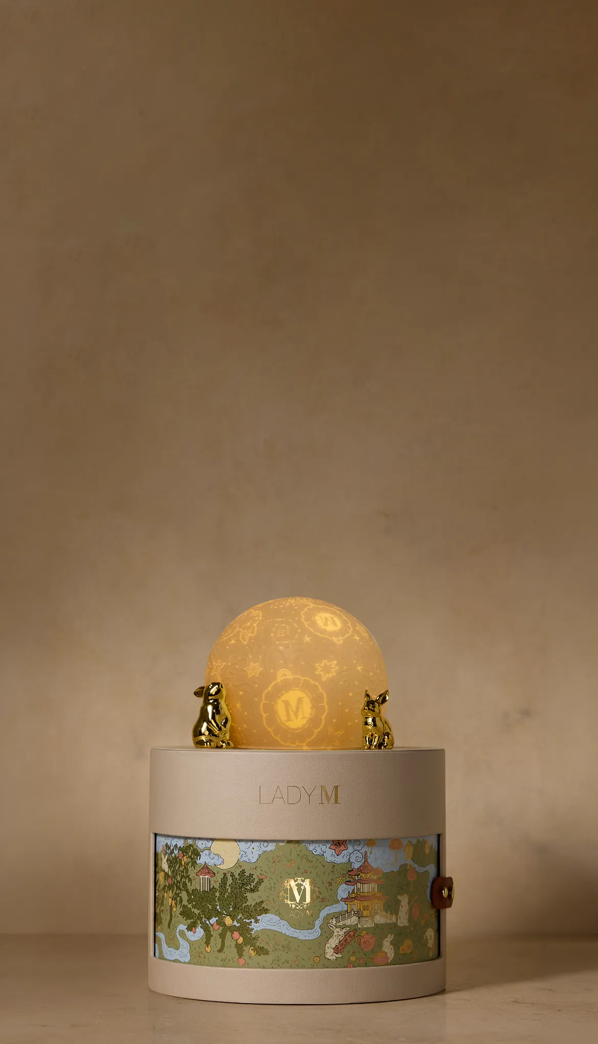 Moonlit Reverie Gift Set with illuminated moon globe atop the keepsake gift box