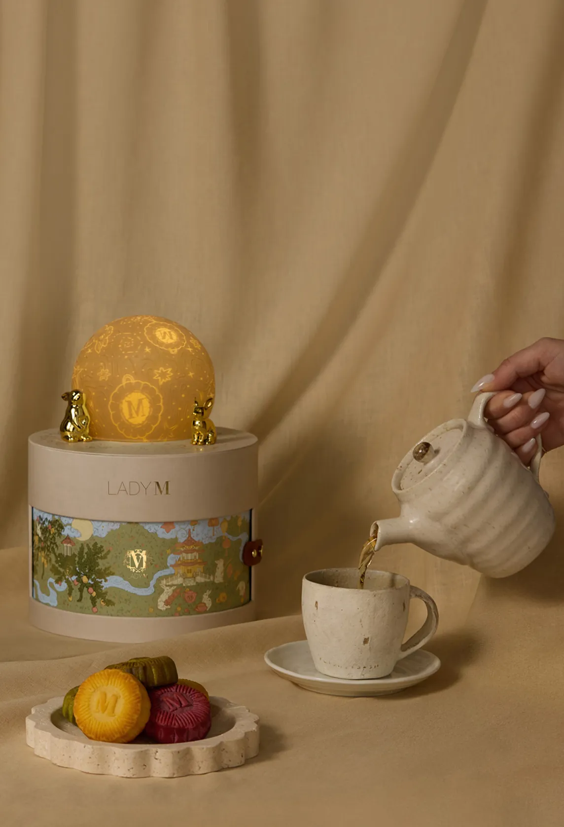 Moonlit Reverie keepsake gift box beside tea service and mooncakes