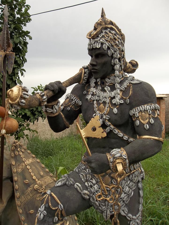 Photograph - An exquisite depiction of Erinle, the Yoruba deity, embellished with cowries, captured by an anonymous photographer and shared on theafricanhistory.com