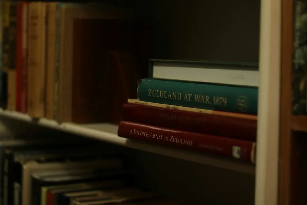 Littafi readers, books, and the desk behind the reviews