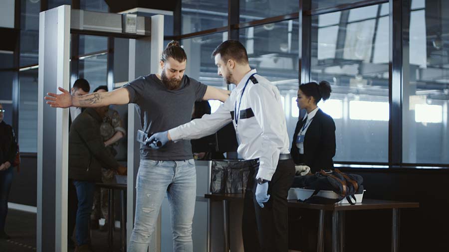 Image of a man going through airport security