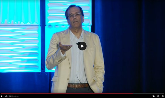 Karim Rahemtulla on stage presenting