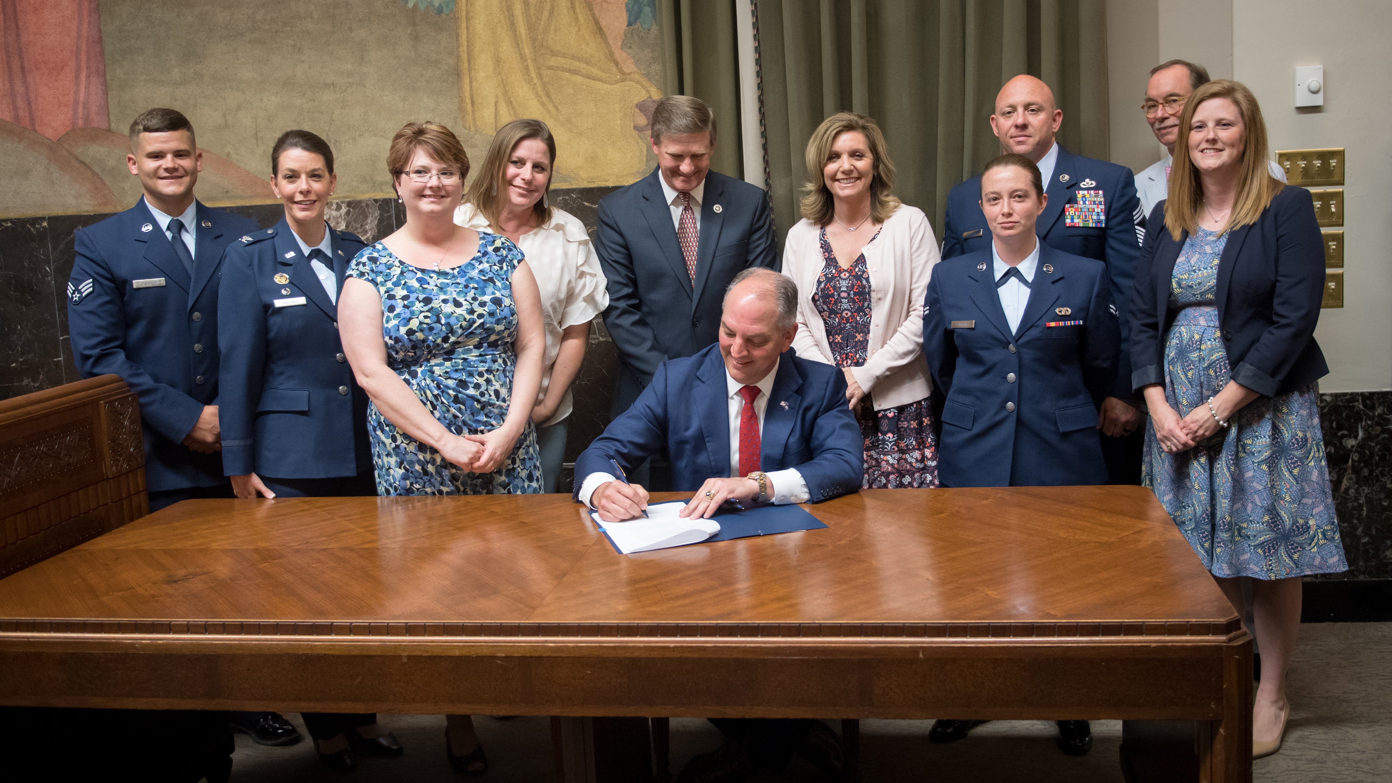 Louisiana Governor John Bel Edwards signing legislation enacting the Enhanced Nurse Licensure Compact. May 31, 2018 at Baton Rogue, Louisiana (U.S. Air Force photo by Senior Airman Stuart Bright)