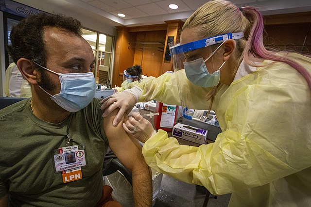 Photo: LPN Leo Cristiano gets the COVID-19 vaccination.
