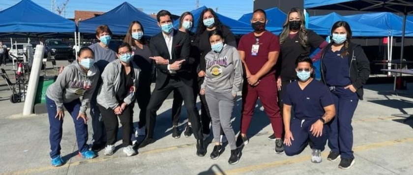 Tom Ellis (Lucifer) with Edlynn Villalon and her colleagues of the COVID RN/LVN Team - December 2022 photo contest winner
