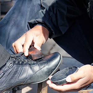 Image of a shoeshine boy working