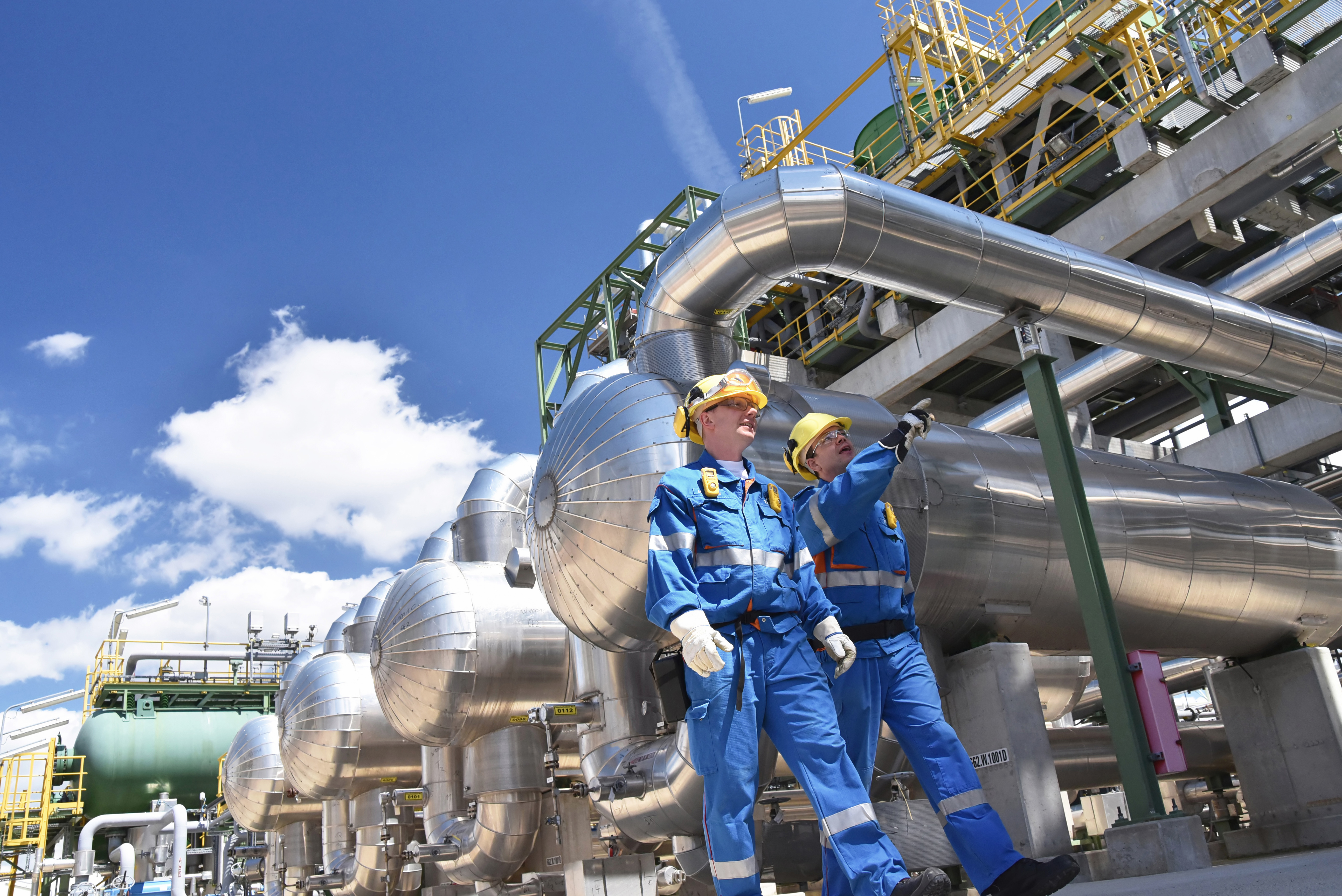 Industrial Workers at an Oil Refinery
