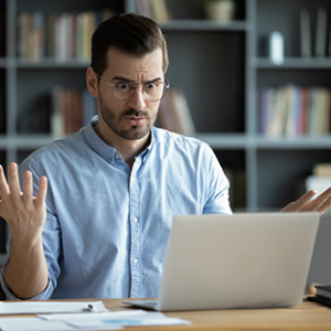 Image of a man throwing his hands in the air