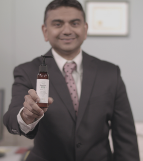 Doctor Holding Bottle CBD