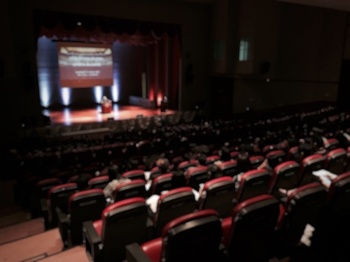 Ted Talk Show on Stage of Theatre