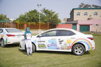 PSH Fairy showing her drawing showcased on indrive car