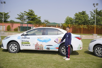 PSH Angel showing her drawing showcased on indrive car