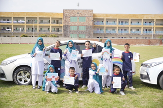 PSH 10 winners showing their drawing