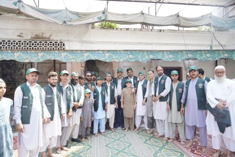 Zamurrad Khan standing with volunteers who are ready to help Flood 2025 victims