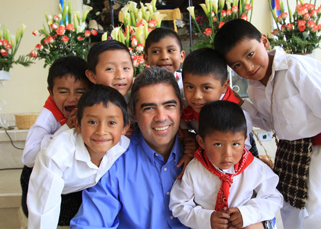 Executive Director Jose Prem posing with boys at church in Mexico