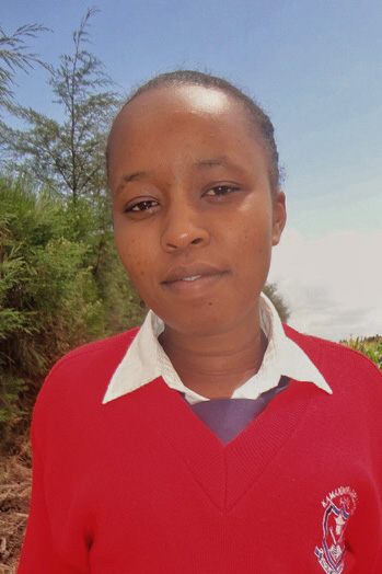 graduatePortraitLucyWearingRedSweaterKenya_2019.jpg