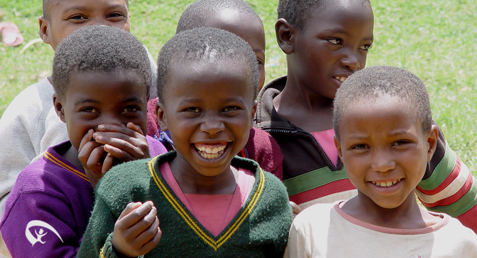 childrenSmilingAtCameraKenya_2019.png