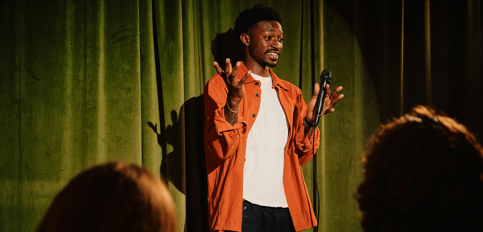 A stand-up comedian makes a joke.