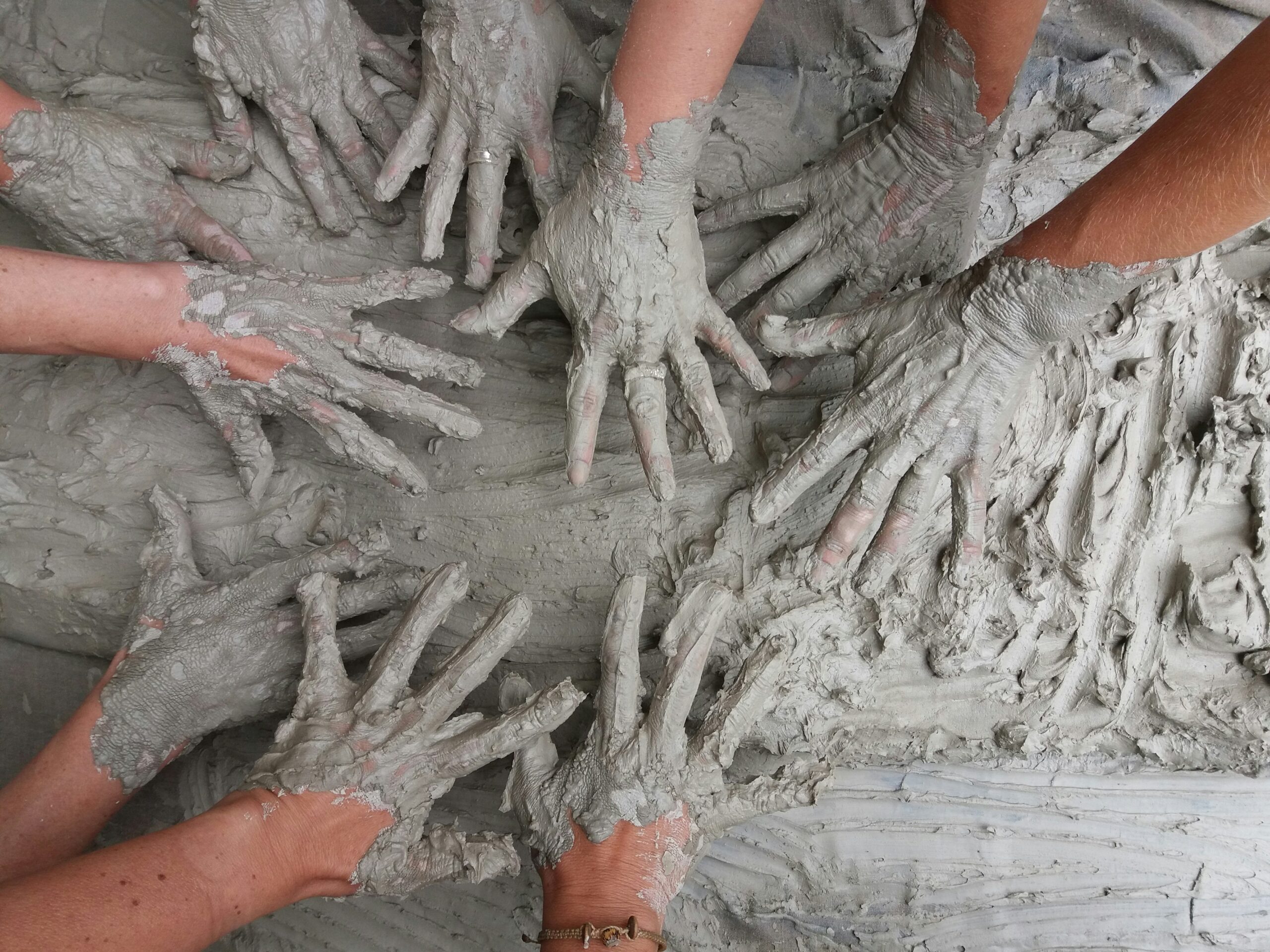A collection of hands getting dirty
