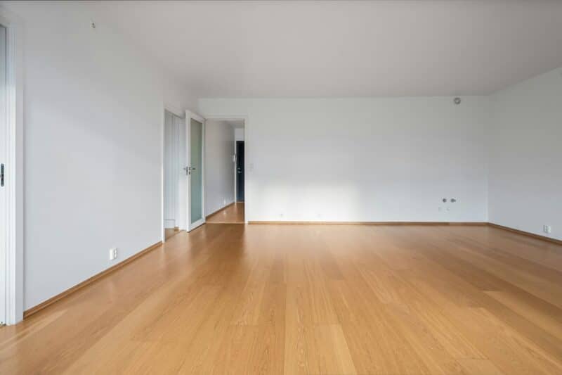 An open door from an empty, blank room.