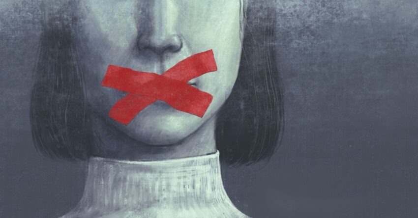 Red tape across woman's mouth