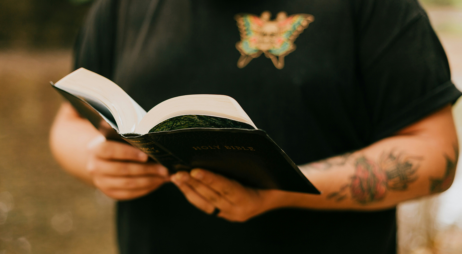 Rugby player reading the Bible.