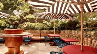 A photo of the Double Standard terrace at The Standard Hotel, King's Cross, in the sunshine