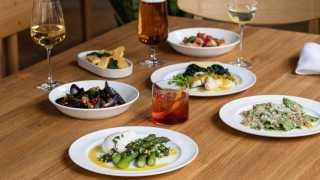 A picture of cocktails, wine and beer at The Italian Greyhound, as well as some pasta and seafood dishes