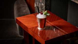 This is an image of the Grinch in the Cup at Le Magritte