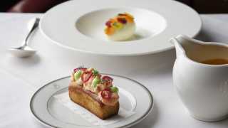 This is an image of a lobster roll at The Colony Grill Room