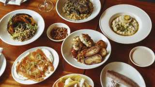 This is an image of a spread of dishes as part of the Slow Sundays menu at Oren