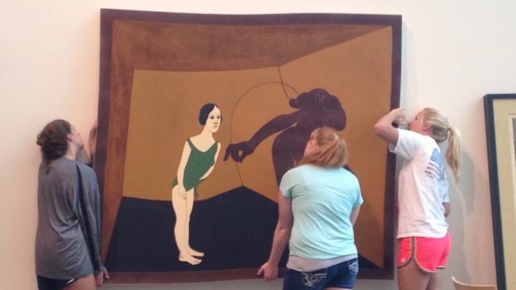 W&L students help install a temporary exhibit on Latin American art.