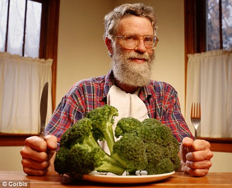 old man eating broccoli