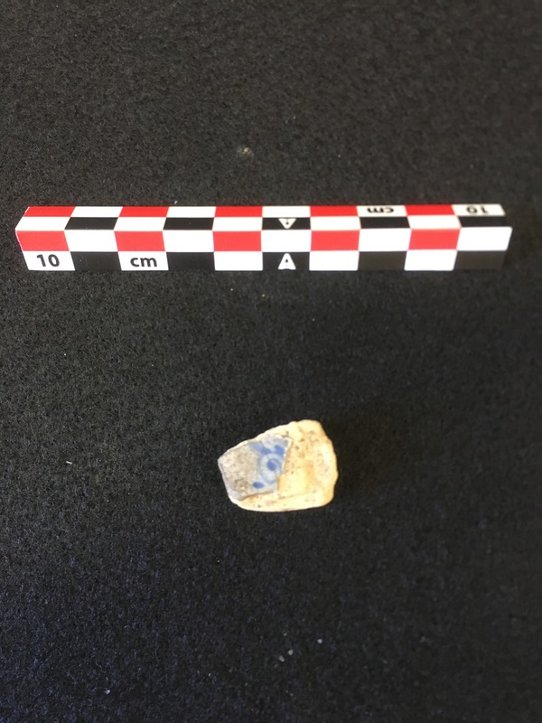 Tin glazed earthenware sherd with hand painted Chinese floral pattern.