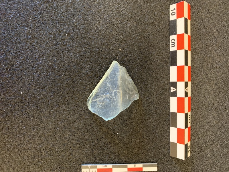 Clear glass bottle fragment