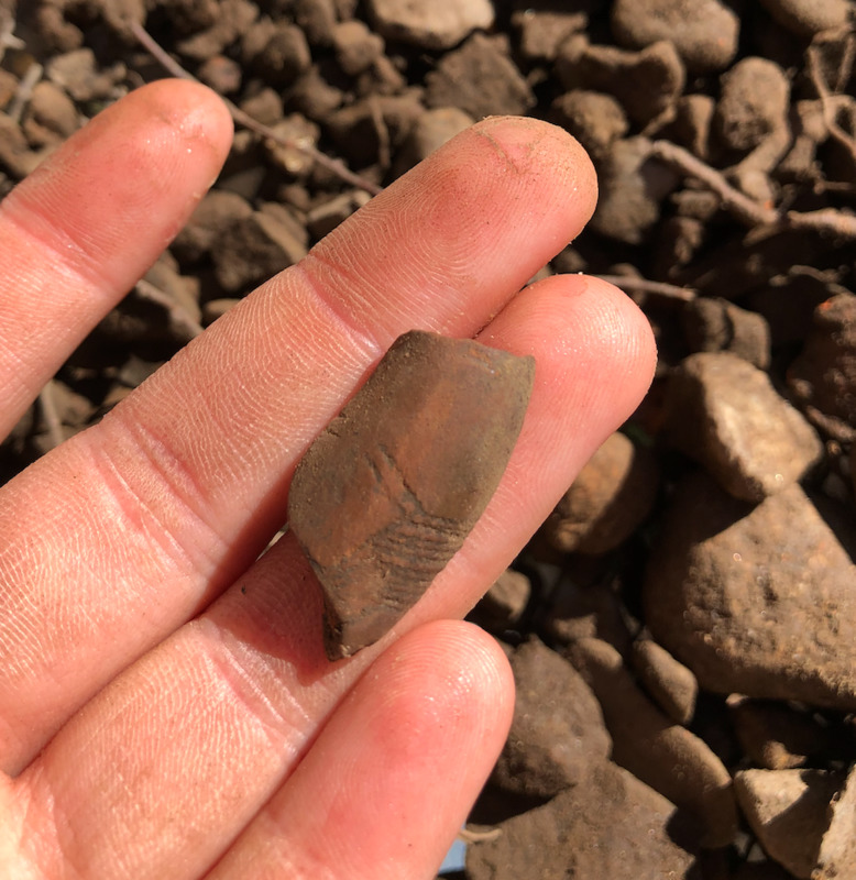Red clay pipe bowl from H968.
