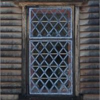 Small, diamond-paned windows with one casement opening were very common in the 17th century.  Lead bars commonly held these windows together.